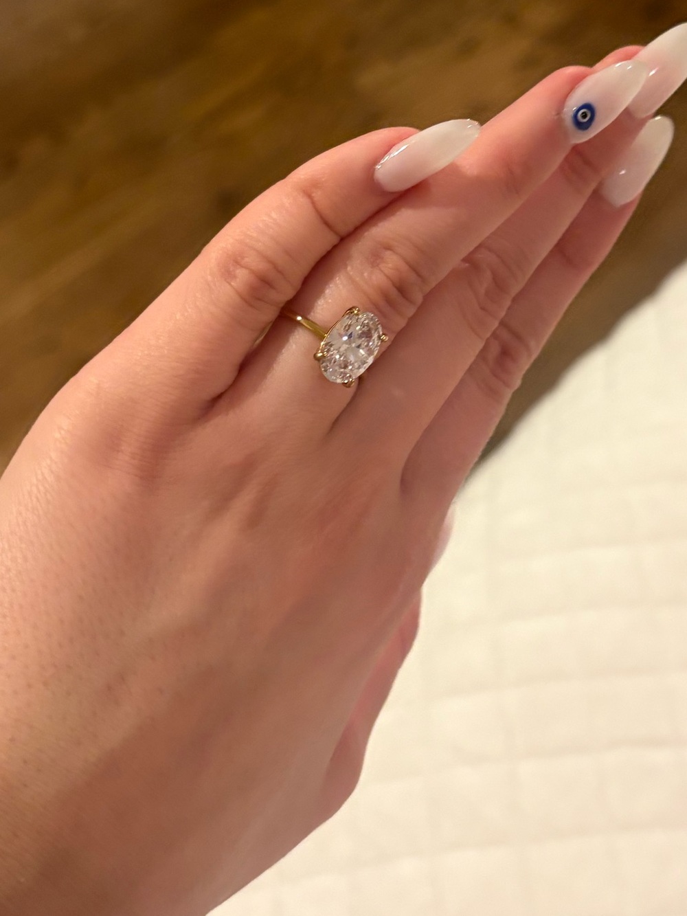 Gold Oval Halo Ring with Clear Center Stone
